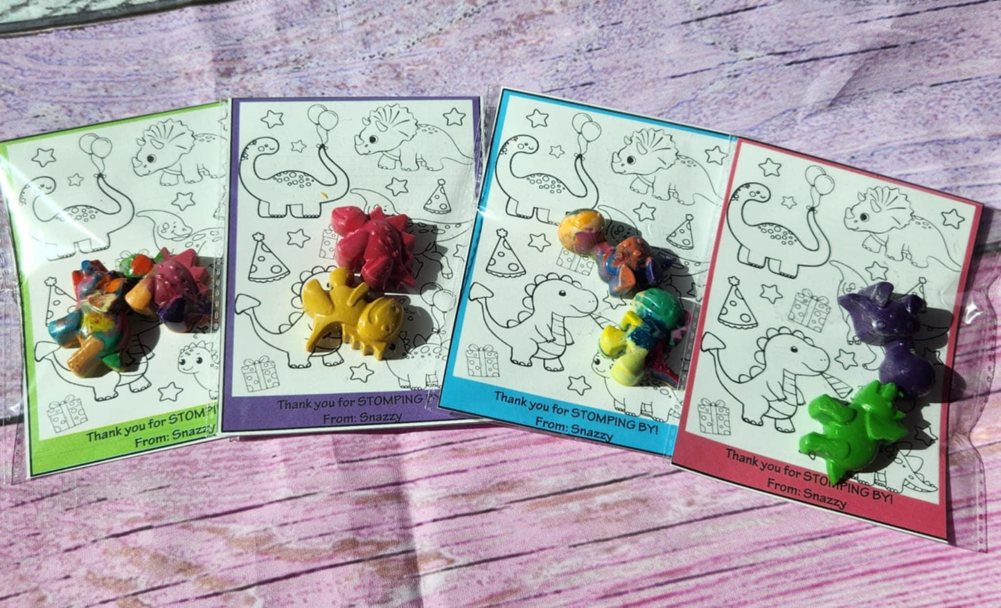 "Dinosaur-themed party favor kit with colorful mini crayons and 4x6 coloring page for kids"
"Dinosaur crayon and coloring page set in clear bag with cardstock topper"
"Handmade non-toxic dinosaur crayons with kids coloring sheet for birthday parties"
"Dino birthday favor with quarter-sized crayons and kids coloring activity"
"School party favor kit with mini dinosaur crayons and fun coloring card"